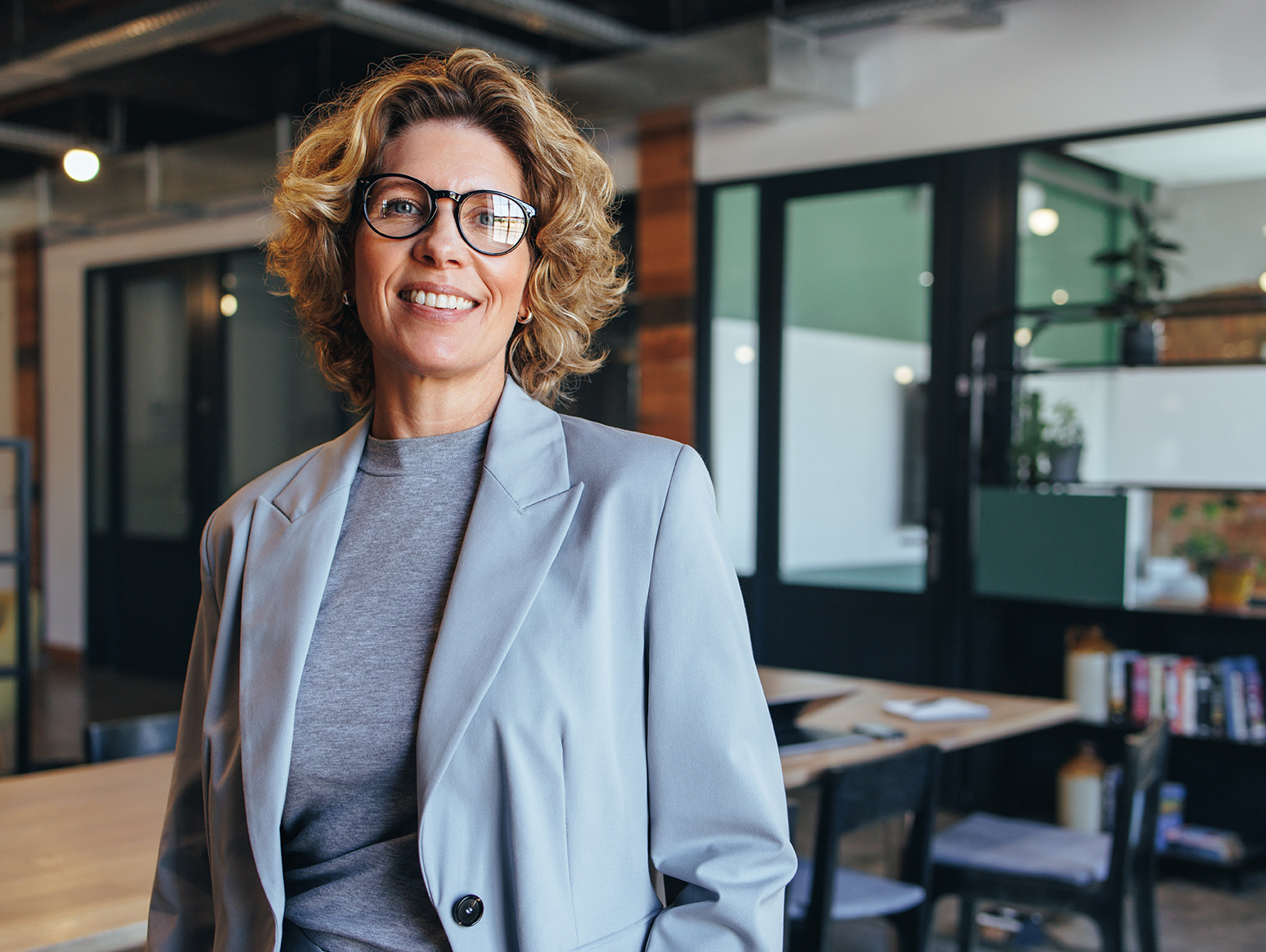 Portrait,Of,A,Professional,Woman,In,A,Suit,Standing,In